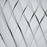 a white and black abstract pattern with lines